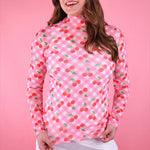 Sheer gingham mesh top with cherry print, mock neckline, and lettuce hems for trendy layered looks.