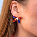 Jess Lea Patriotic bow earrings with stars, stripes, pearls, and rhinestones in 18K gold-plated design.