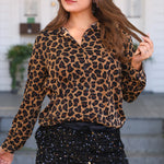 Leopard button-up tunic with collar and long sleeves in lightweight, flowy polyester.