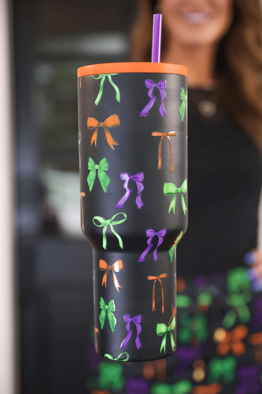Bow Bewitched Tumbler with spooky bow print, reusable straw, screw-on lid, and handle.