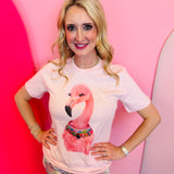 Pink flamingo graphic tee with rhinestone collar detail.