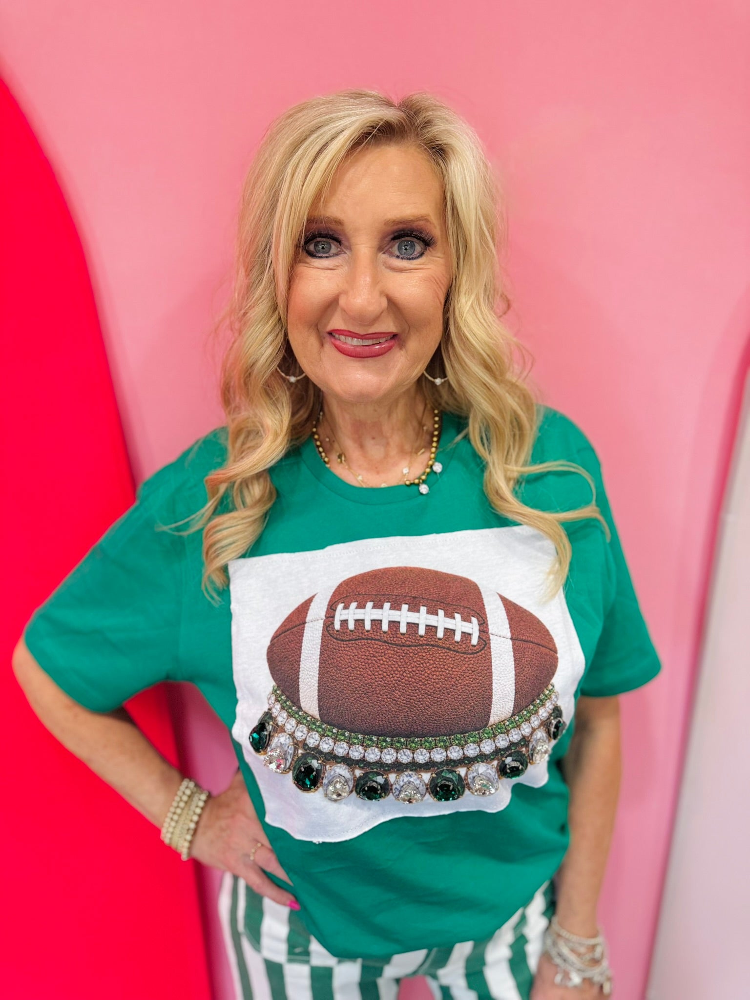 Green football tee with oversized green and clear rhinestone crystals and football patch.