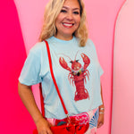 Blue tee with lobster graphic and rhinestone embellished collar detail