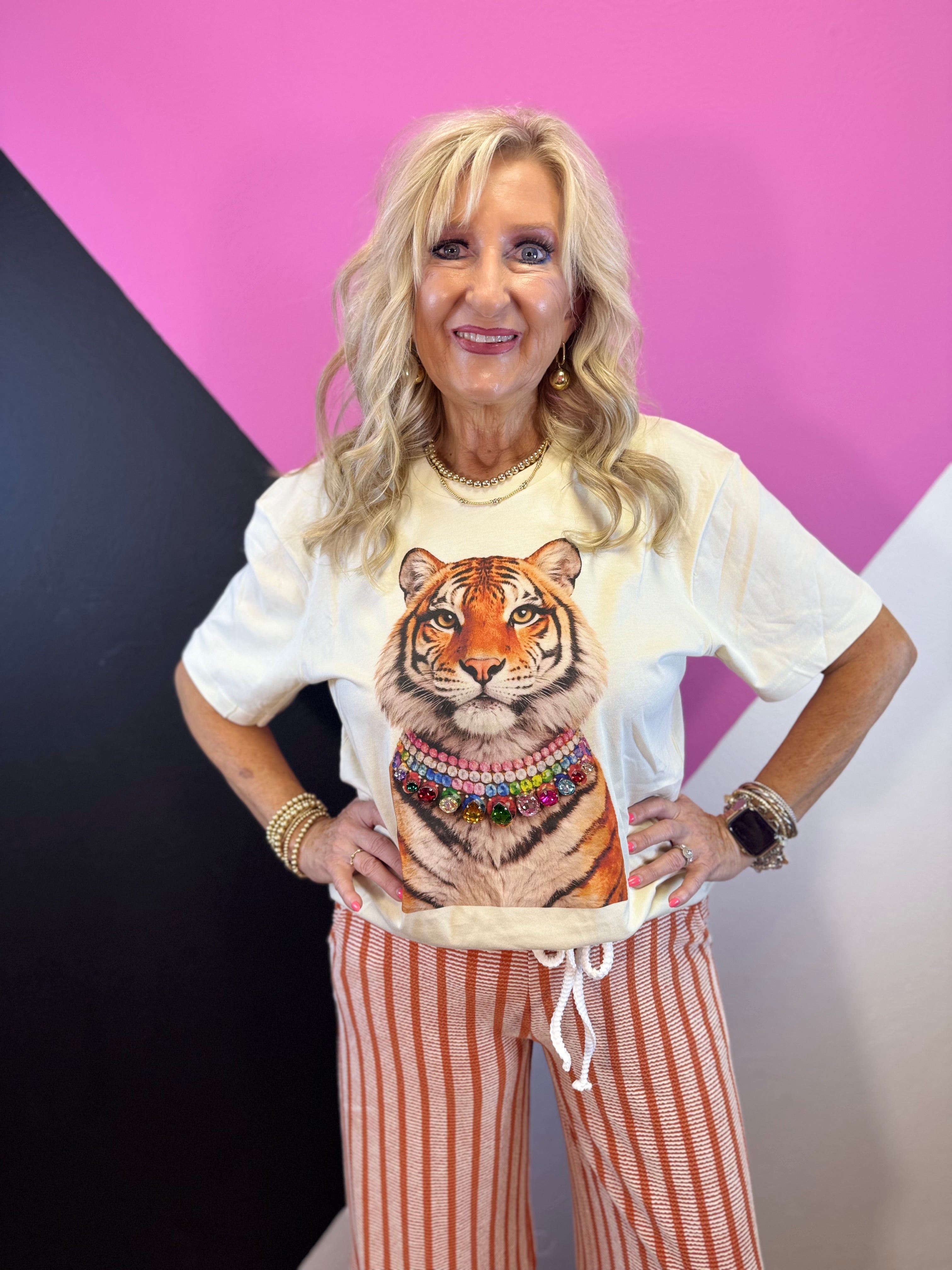 Natural tiger graphic tee with layered necklace design and sparkling multicolored jewels.
