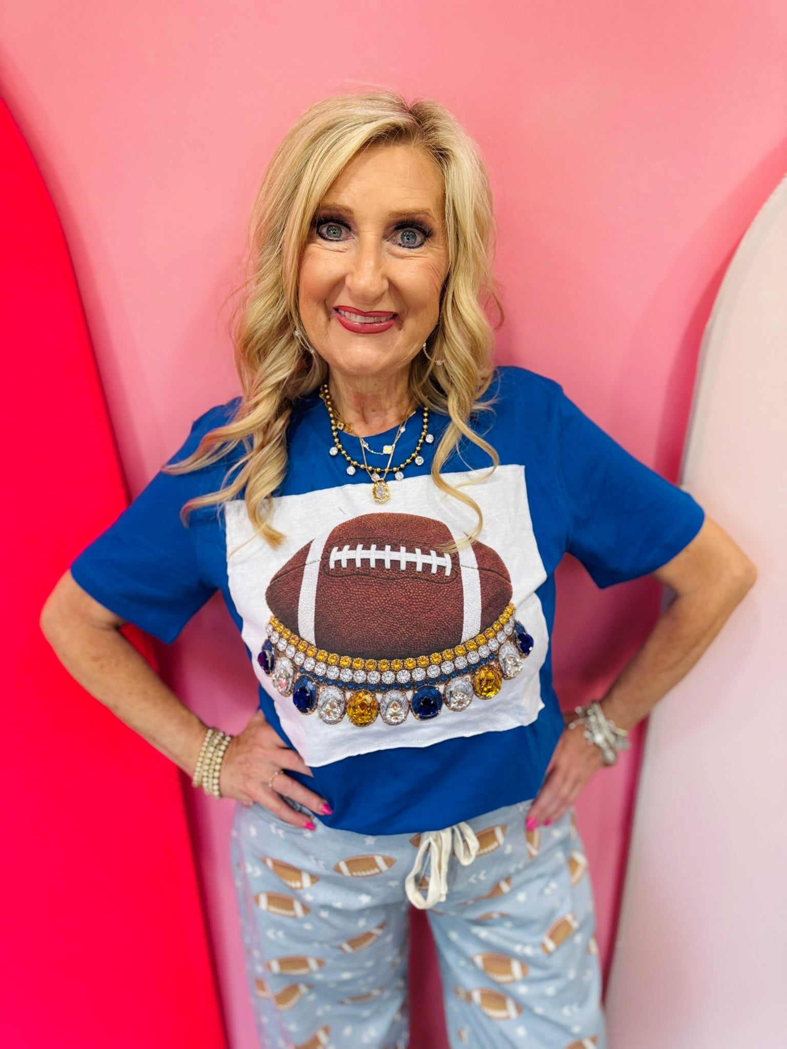 Royal blue football tee with yellow, blue, and clear rhinestone crystals.