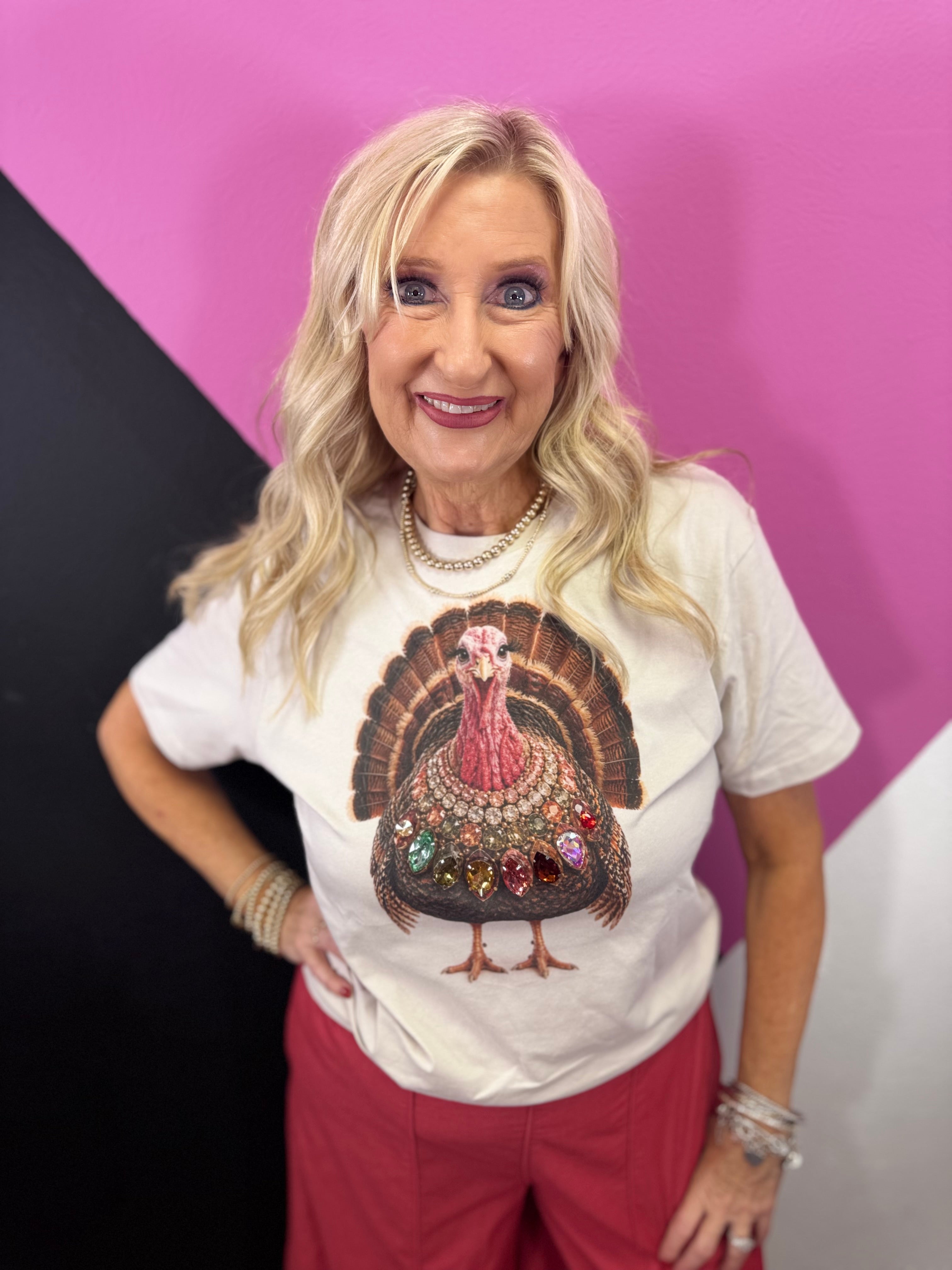 Turkey graphic tee with oversized multicolored jewel necklace and sparkling rhinestone accents.
