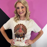 Turkey graphic tee with oversized multicolored jewel necklace and sparkling rhinestone accents.