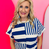 Royal blue and white striped colorblock top with mixed stripe panels and relaxed drop shoulder fit