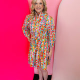 Colorful floral tiered shirt dress with waist tie and button front