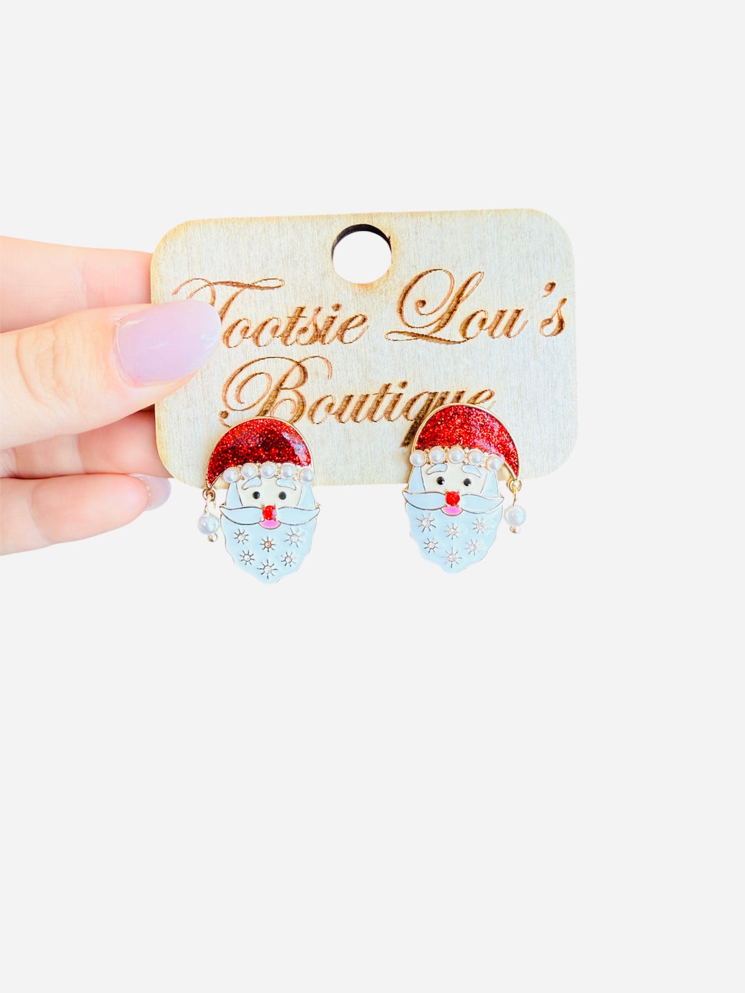 Santa earrings with glitter hat, pearl trim, and snowflake-detailed beard for festive holiday style.