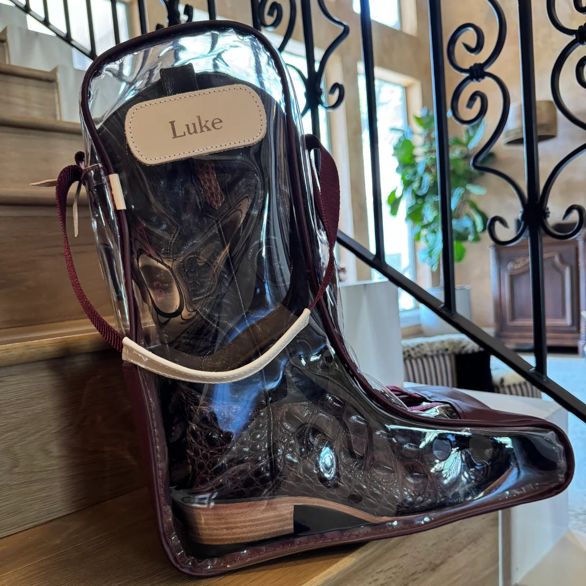 Jon Hart clear boot bag with Natural Leather trim, zip closure, and carrying handles.