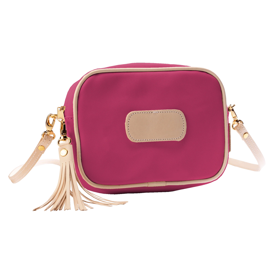 Jon Hart Lola Crossbody, 6.5x9x2.5 in, coated canvas with leather trim and tassel accent.