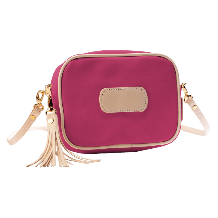 Jon Hart Lola Crossbody, 6.5x9x2.5 in, coated canvas with leather trim and tassel accent.