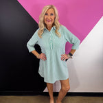 Kelly green striped collared shirt dress with button front, chest pocket, and three-quarter sleeves