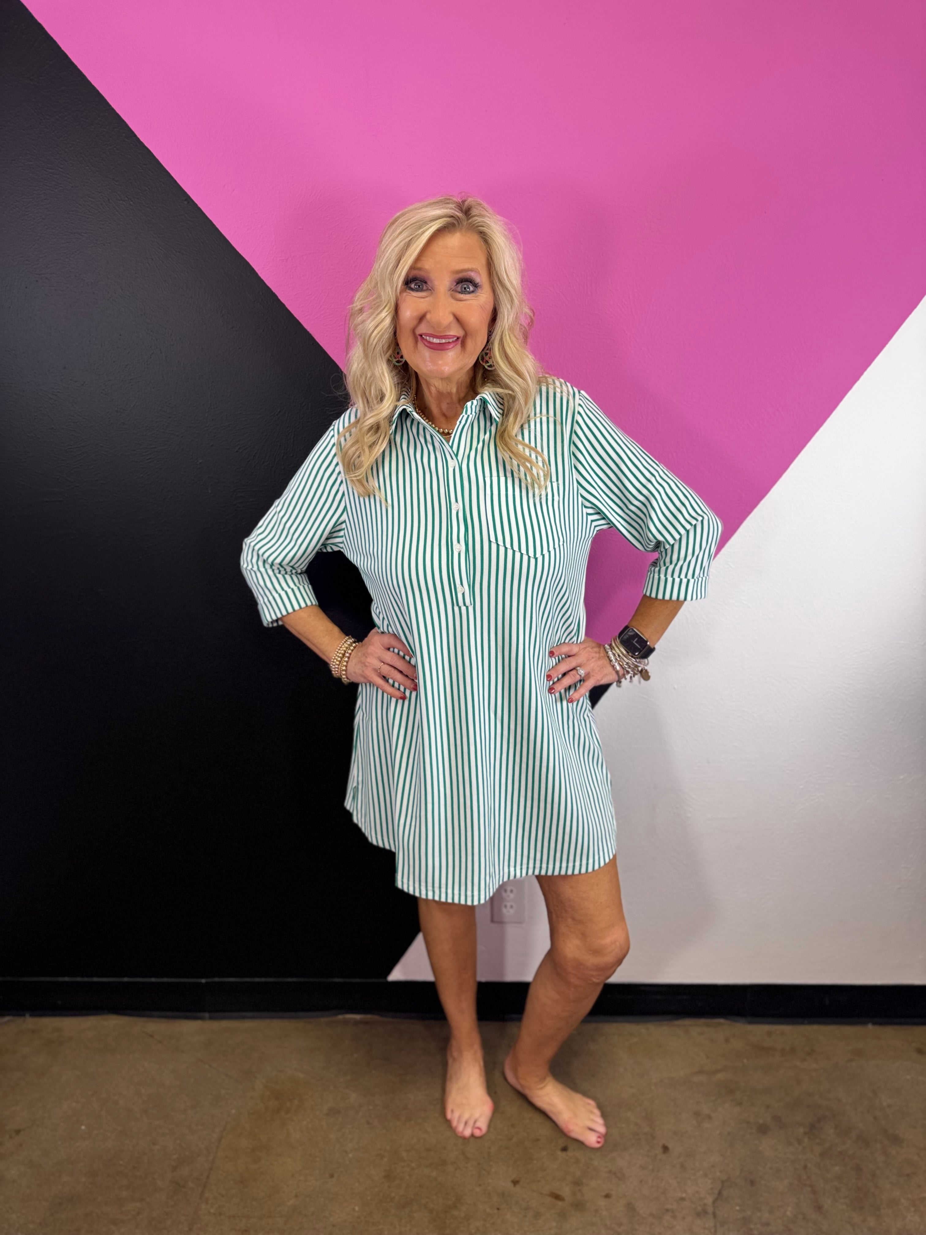 Kelly green striped collared shirt dress with button front, chest pocket, and three-quarter sleeves