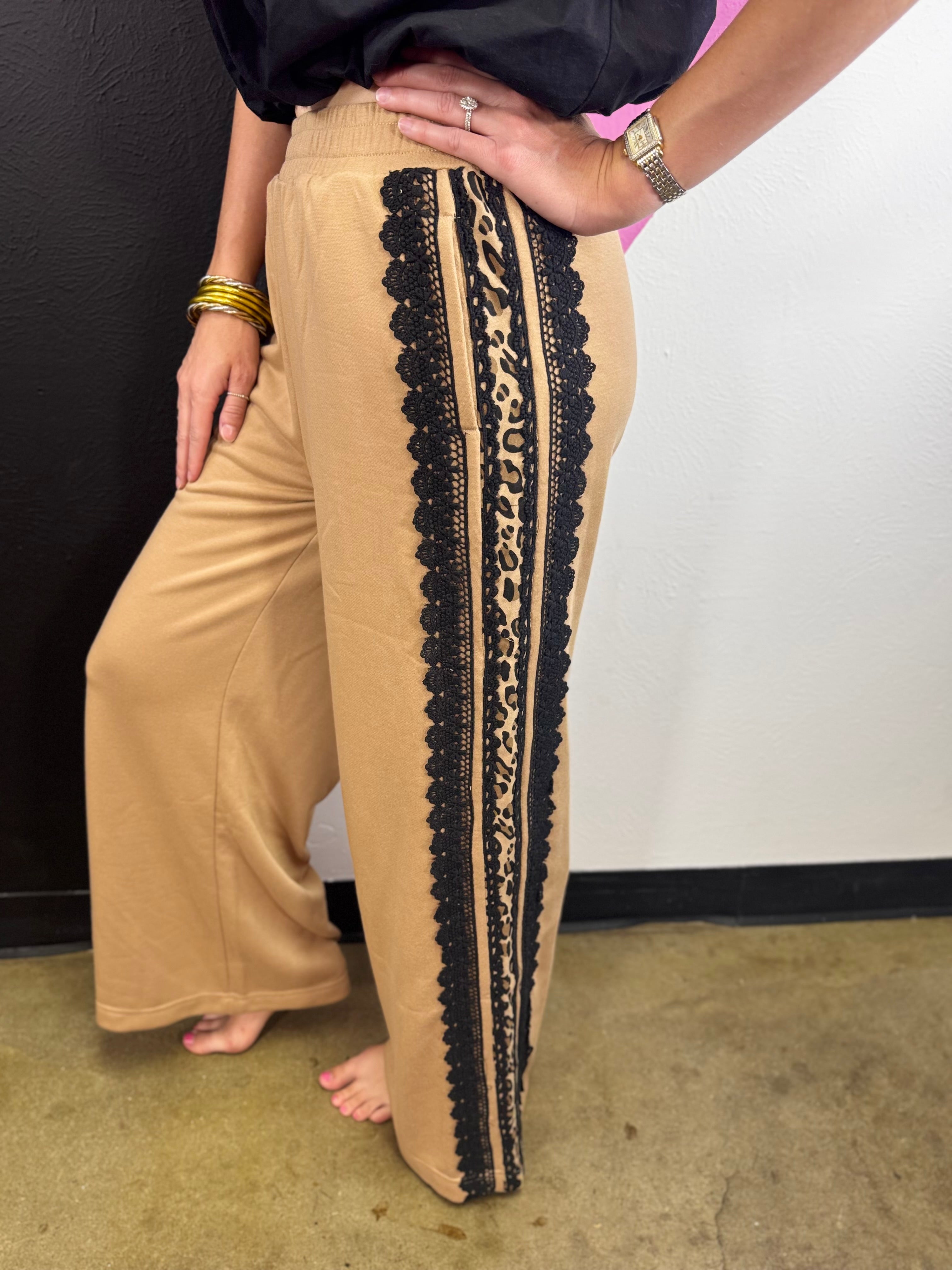 Sweatpants with leopard print side stripes, lace trim and elastic waistband.