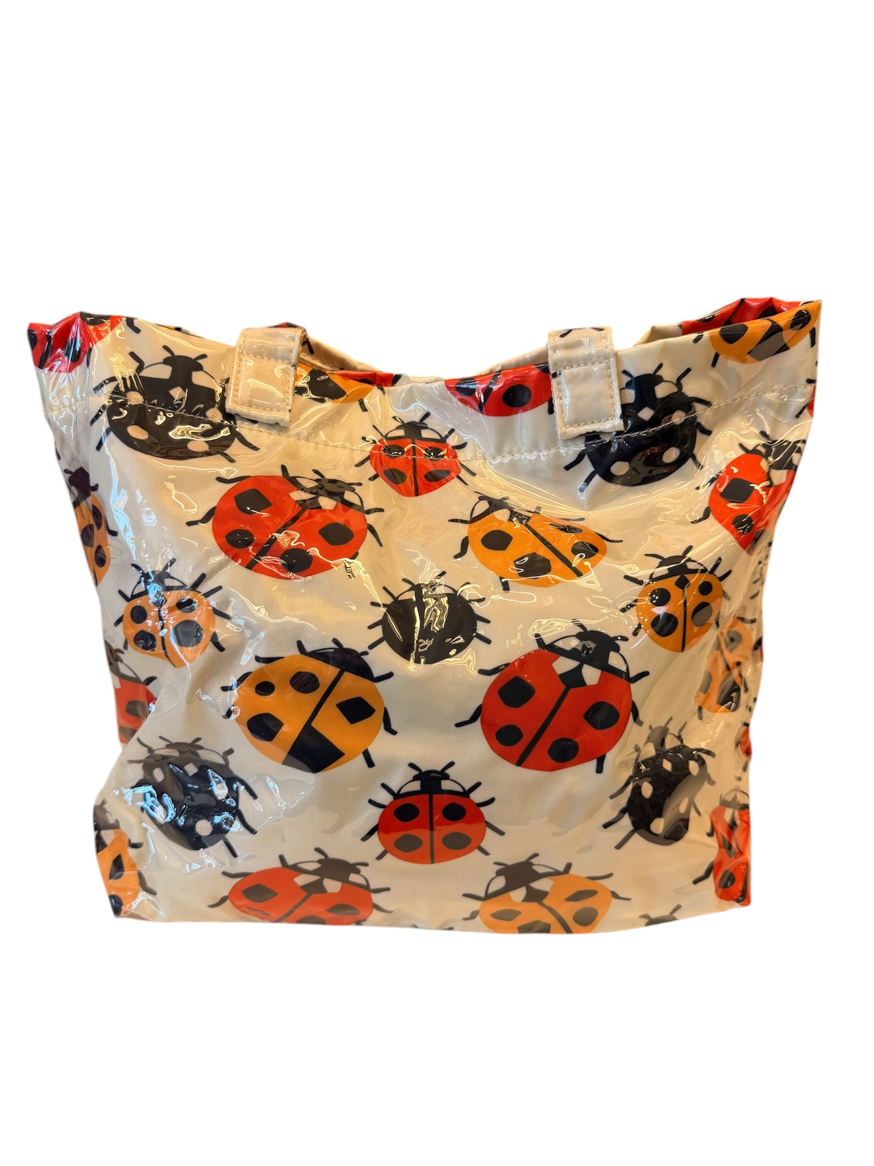 Ladybug tote bag with double handles, interior pockets, and Velcro closure.