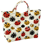 Ladybug tote bag with double handles, interior pockets, and Velcro closure.
