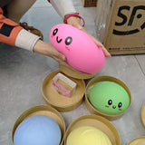 Large dumpling squishy stress toy with soft sensory texture.