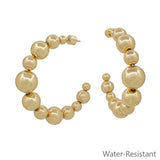 Gold graduated beaded hoop earrings, water resistant and lightweight.