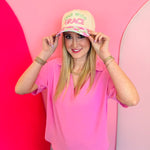 Neutral Lead With Grace hat with floral gingham brim and pink green embroidery.