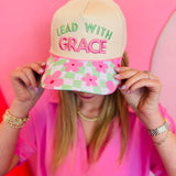 Neutral Lead With Grace hat with floral gingham brim and pink green embroidery.