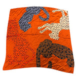 Burnt orange satin bandana scarf with brown, orange, cream, and grey leopard print design.