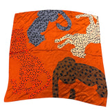 Burnt orange satin bandana scarf with brown, orange, cream, and grey leopard print design.