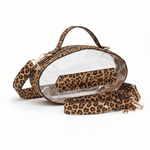 Leopard print football-shaped crossbody bag with gold hardware, top handle, and adjustable strap.