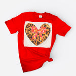 Red tee with leopard heart patch, pink bow, and sparkling bling accents on soft cotton.