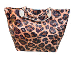Leopard print PVC tote bag with glossy finish, sturdy handles, interior pockets, and Velcro closure.