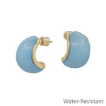 Light blue acrylic gold .5 inch water resistant earrings with polished finish.