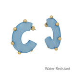 Light blue gold studded hoop earrings, water resistant and lightweight.