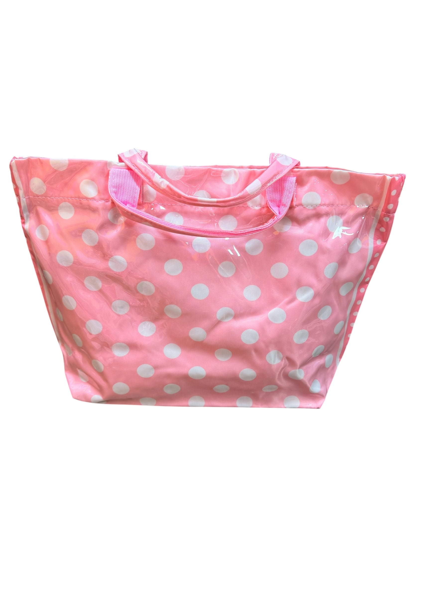 Light pink PVC tote bag with white polka dots, darker pink sides, and sturdy handles.