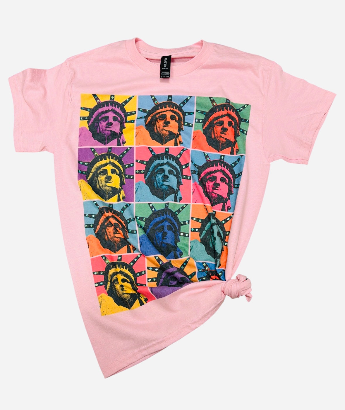Soft pink Lady Liberty graphic tee with colorful retro artwork and rhinestone accents.