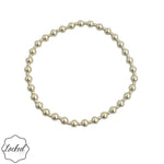 Gold filled beaded bracelet with mixed 2mm and 4mm beads and stretch fit.