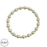 Gold filled beaded bracelet with mixed 4mm and 6mm beads and stretch fit.