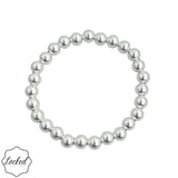 7mm sterling silver beaded bracelet with stretch fit and anti-tarnish finish.