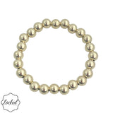 8mm gold filled beaded bracelet with stretch fit and waterproof design.