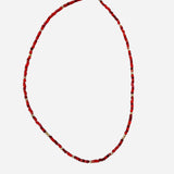 Gold filled necklace with red beads and gold accent details.
