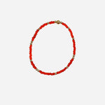 Gold filled bracelet with dark orange Czech glass beads and stretch fit design.