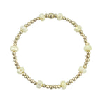 Gold filled bracelet with mango yellow frosted crystals and stretch fit design.