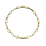Gold filled bracelet with mango yellow frosted crystals and stretch fit design.