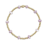 Gold filled bracelet with lavender frosted crystals and stretch fit design.