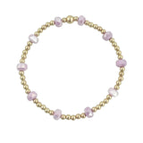 Gold filled bracelet with lavender frosted crystals and stretch fit design.