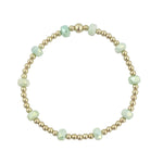 Gold filled bracelet with mint green frosted crystals and stretch fit design.