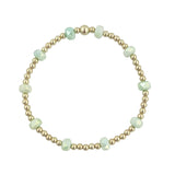 Gold filled bracelet with mint green frosted crystals and stretch fit design.