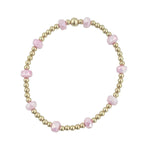Gold filled bracelet with frosted pink crystals and stretch fit design.