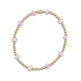 Gold filled bracelet with frosted pink crystals and stretch fit design.