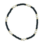 Black waterproof game day bracelet with gold-filled beads and glass pearl accents.